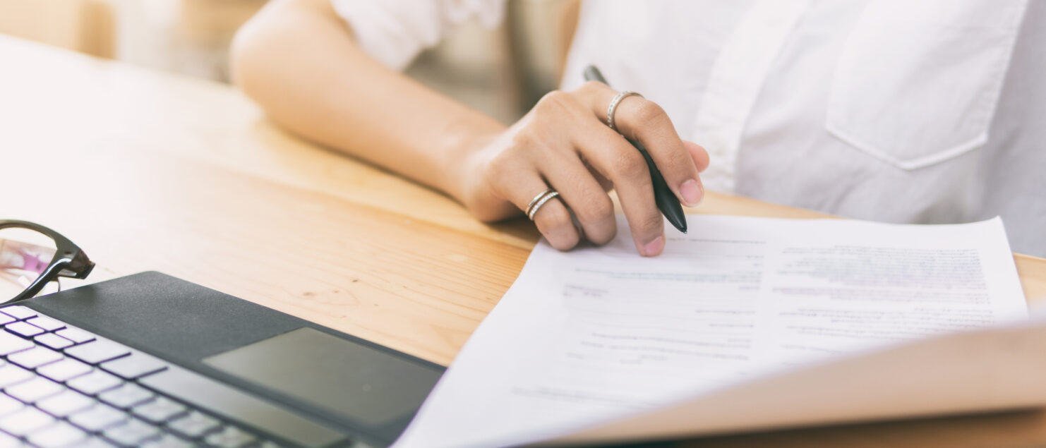 A woman going through some paperwork.