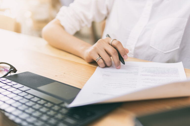 A woman going through some paperwork.
