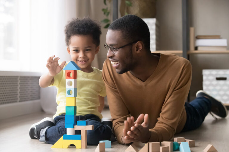 A father and son playing together.