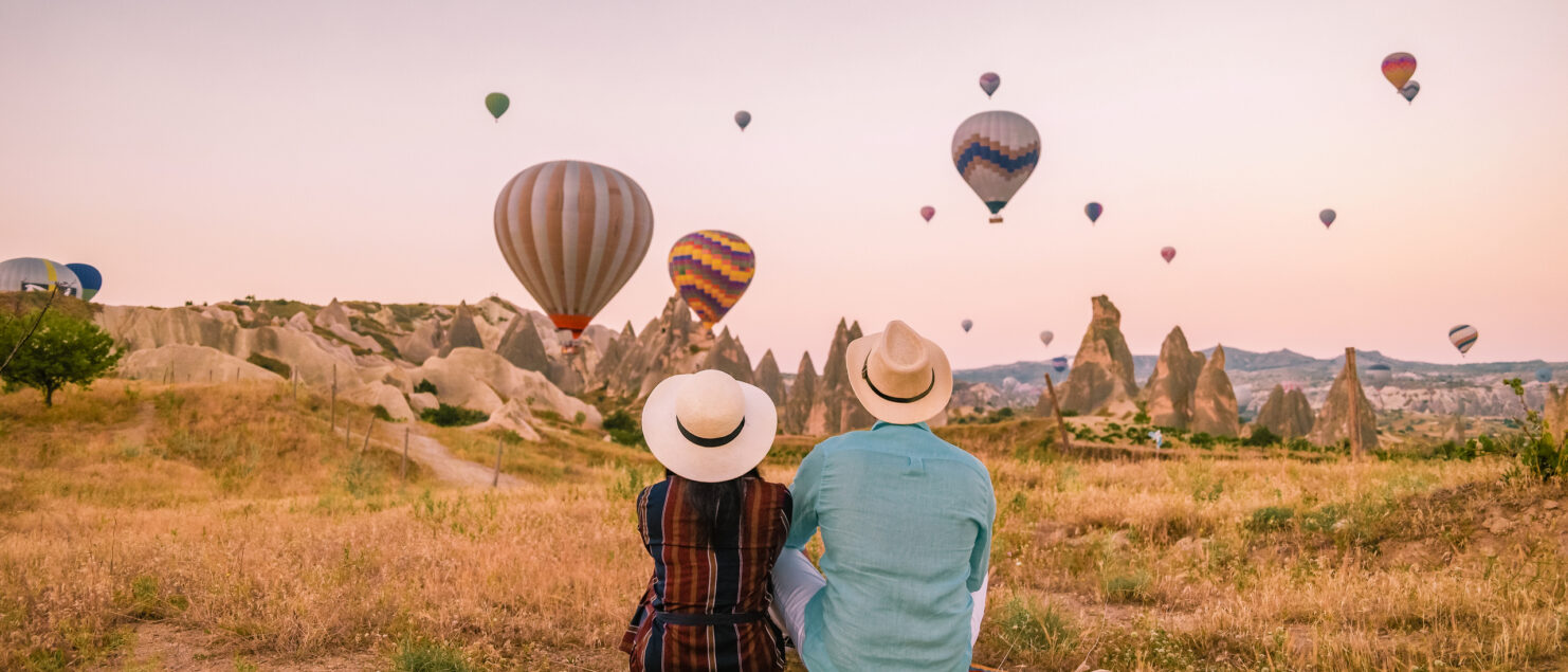 A couple watching hot air balloons in Turkey.