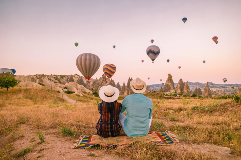 A couple watching hot air balloons in Turkey.