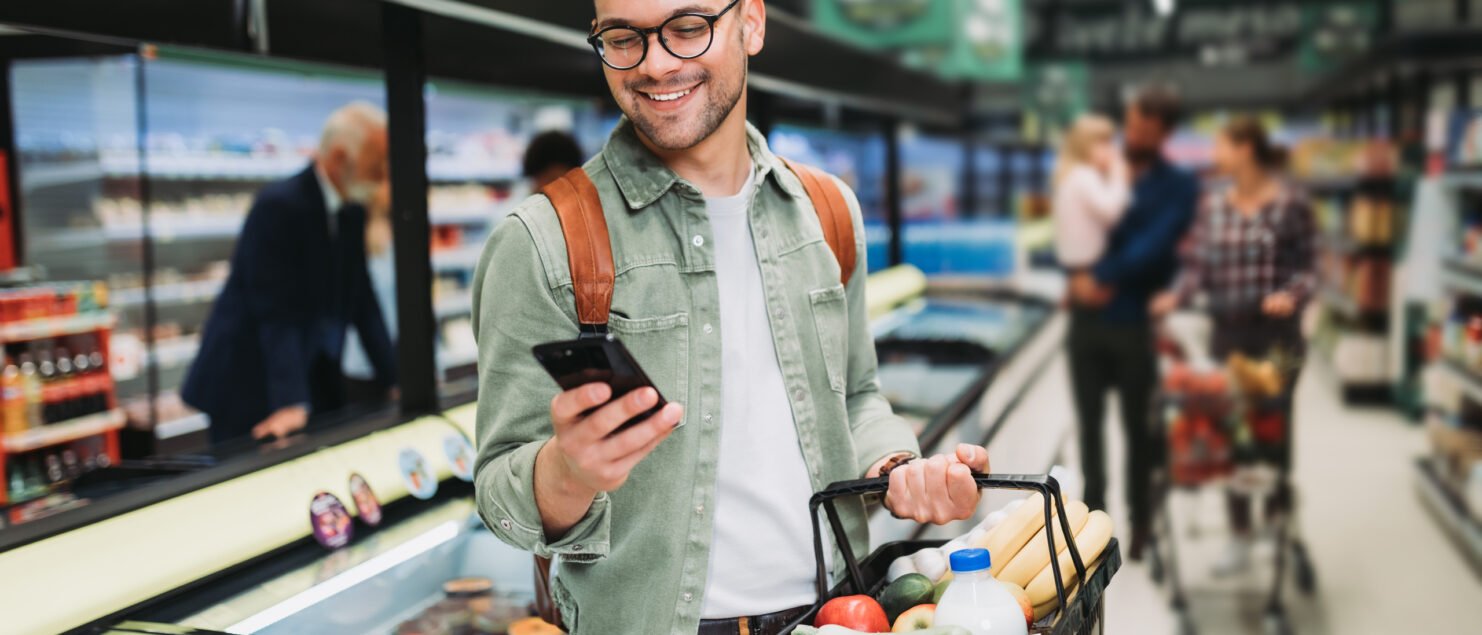 A man shopping in a supermarket.