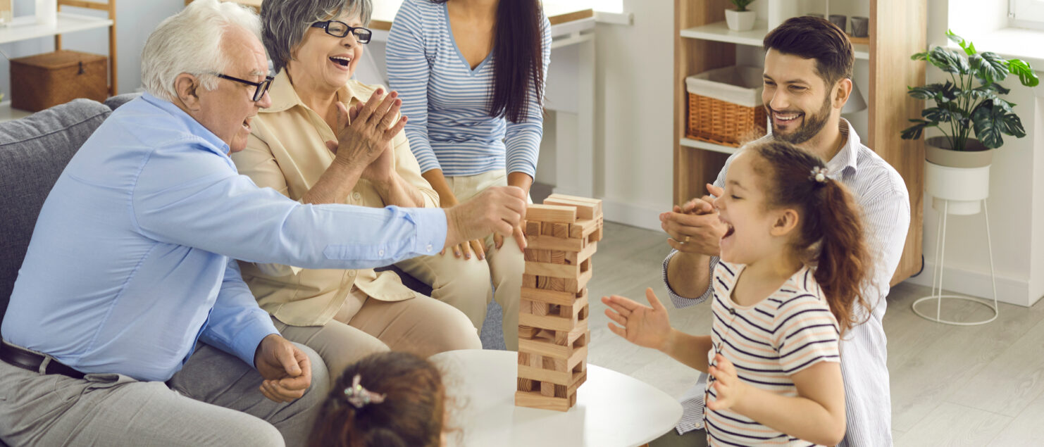 Grandparents playing a game with their grandchildren.