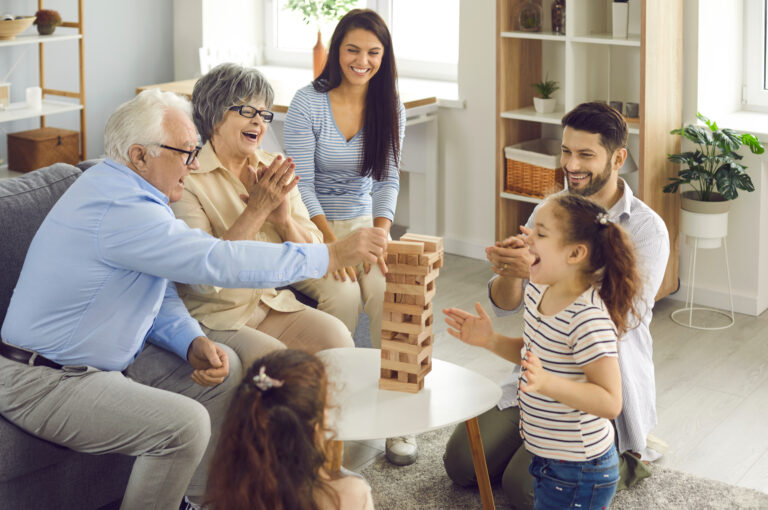 Grandparents playing a game with their grandchildren.