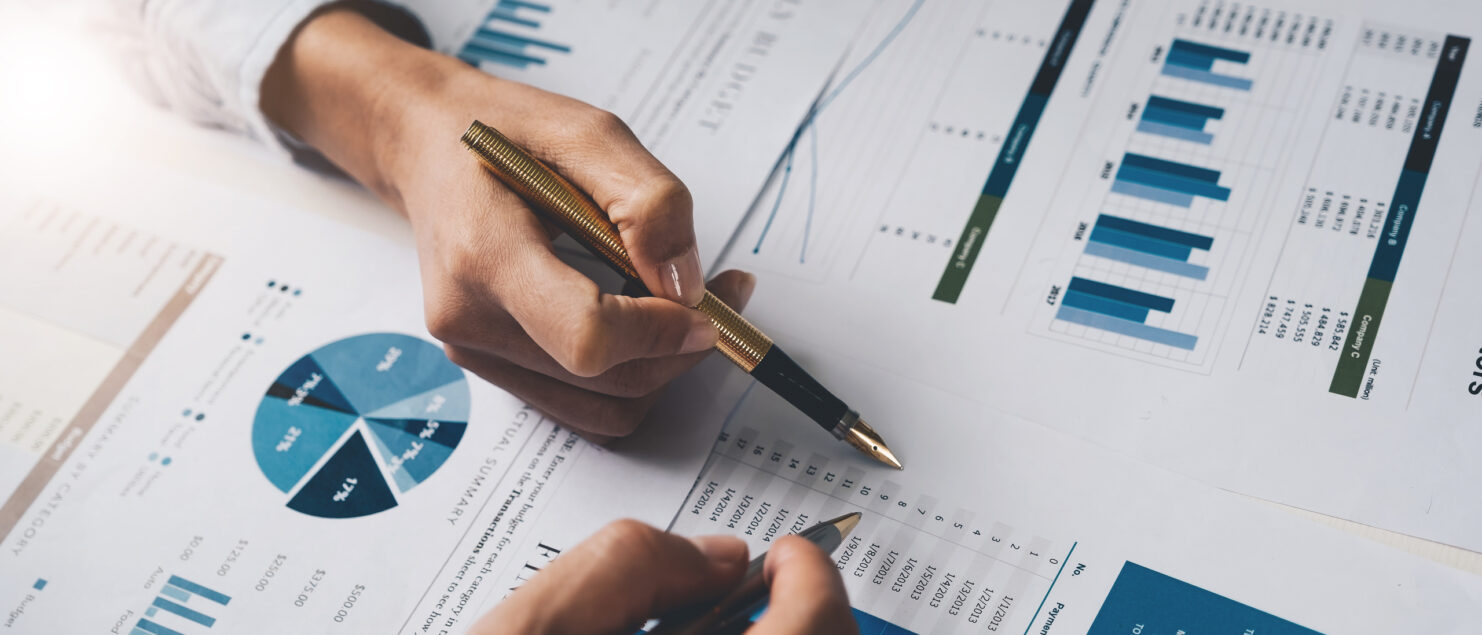 Two people looking at financial documents.